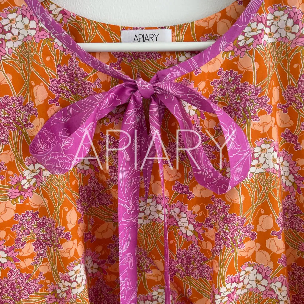 
                  
                    Grace in Liberty Fuschia Flowers
                  
                