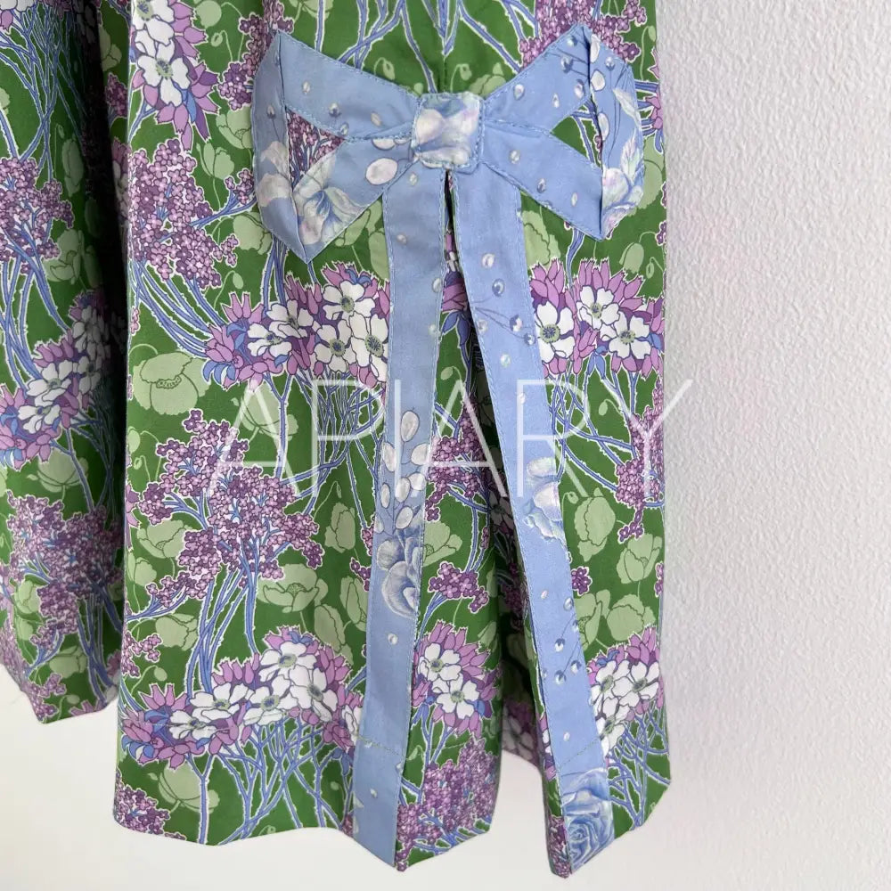 
                  
                    Grace in Liberty Purple Flowers 40’’/7 years
                  
                
