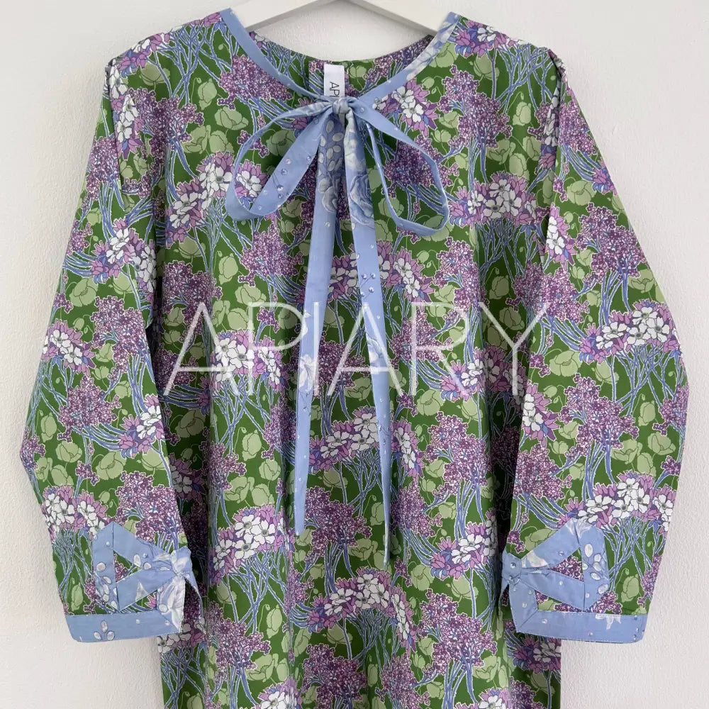 
                  
                    Grace in Liberty Purple Flowers 40’’/7 years
                  
                