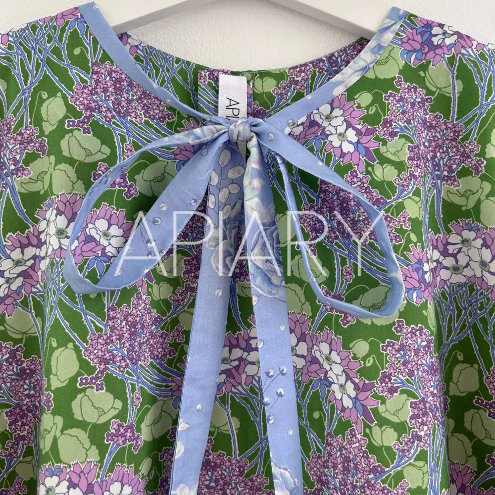 
                  
                    Grace in Liberty Purple Flowers 40’’/7 years
                  
                