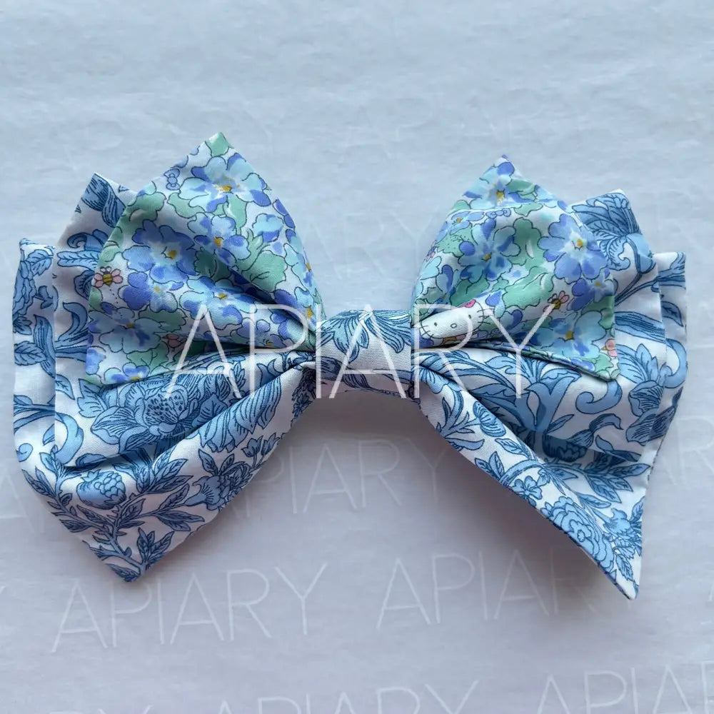 
                  
                    Liberty Sambourne Blue Bow Hairclip
                  
                