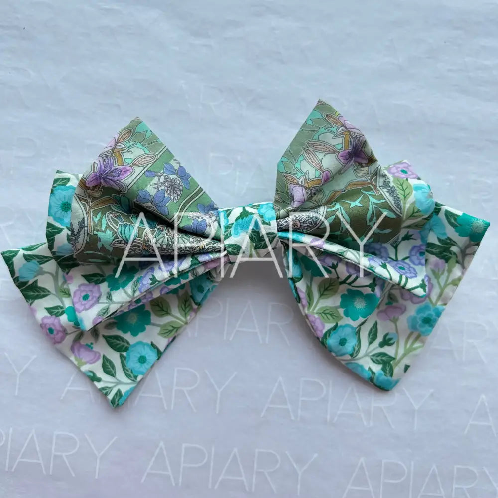 
                  
                    Liberty Vigers Sketch Green/Purple Bow Hairclip
                  
                